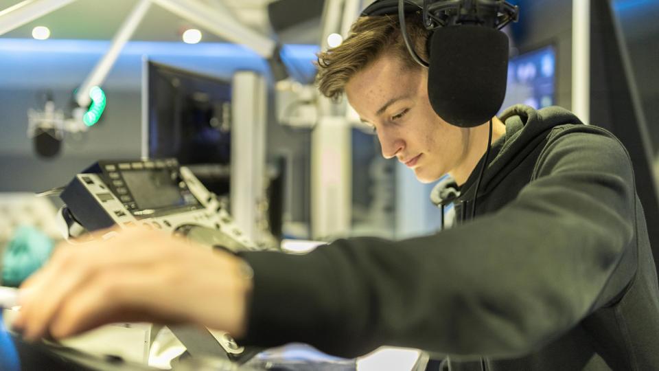 A student working in the Blast FM studio at the University of West London