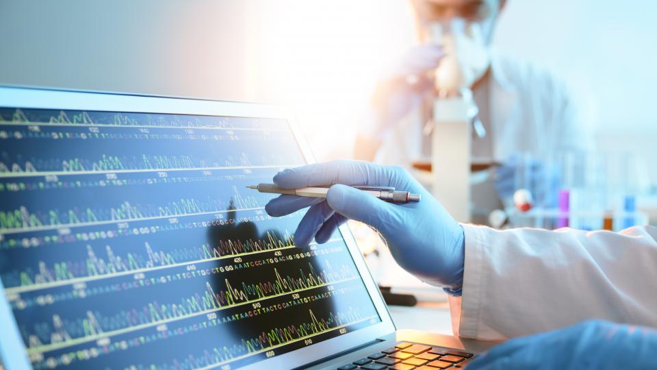 A biomedical scientist monitoring health data