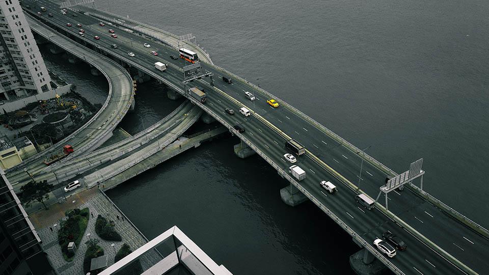 picture of a bridge with cars on taken from above