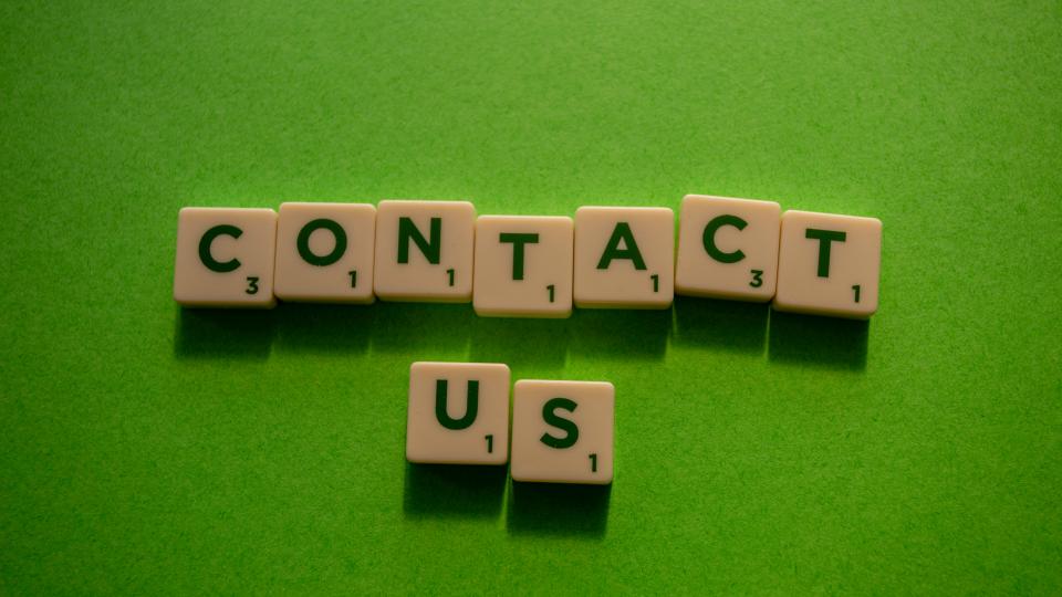 Contact us on green background
