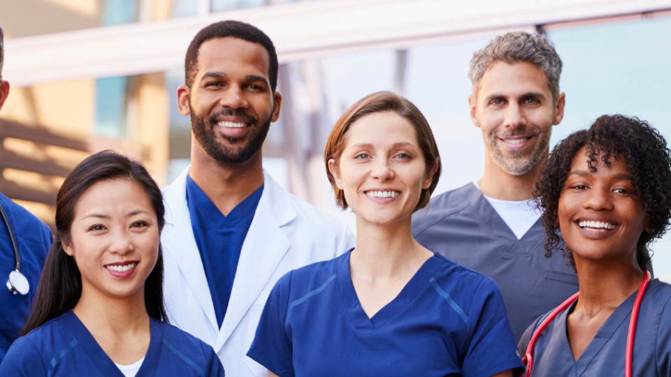 A diverse team of nurses in scrubs