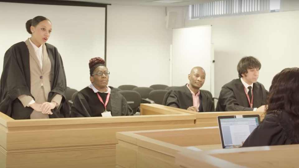 Law students holding a mock trial in UWL's mock court room