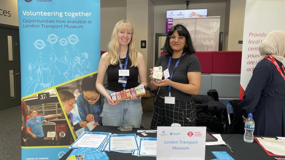 Reps from London Transport Museum smiling at their stand a the University of West London volunteering fair.