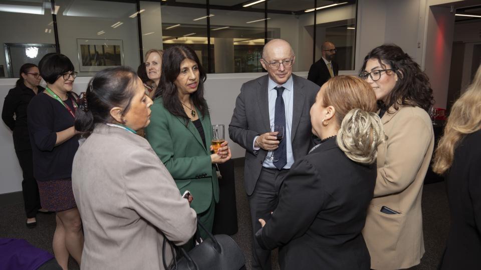 Lubna Shuja, Clive Coleman and others networking at the Public Lecture at UWL.