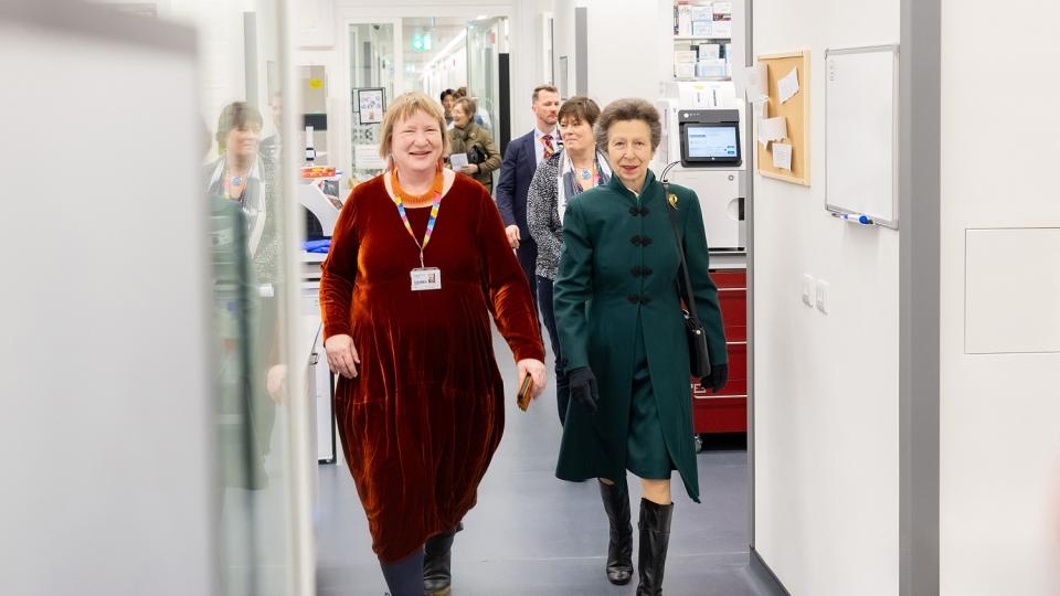 HRH Princess Anne walking through the LMS facility with staff members