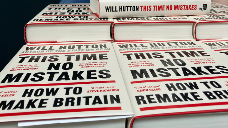 A stack of copies of This Time No Mistakes by Will Hutton