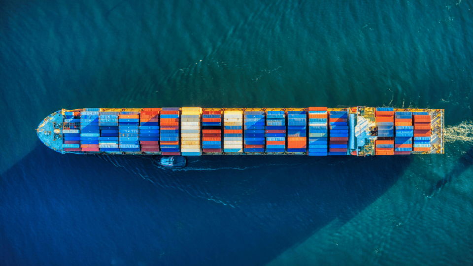 Aerial view of multicoloured containers on a ship at sea