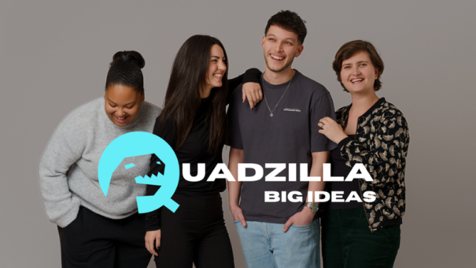 Four students smiling whilst standing with the Quadzilla logo superimposed over them.
