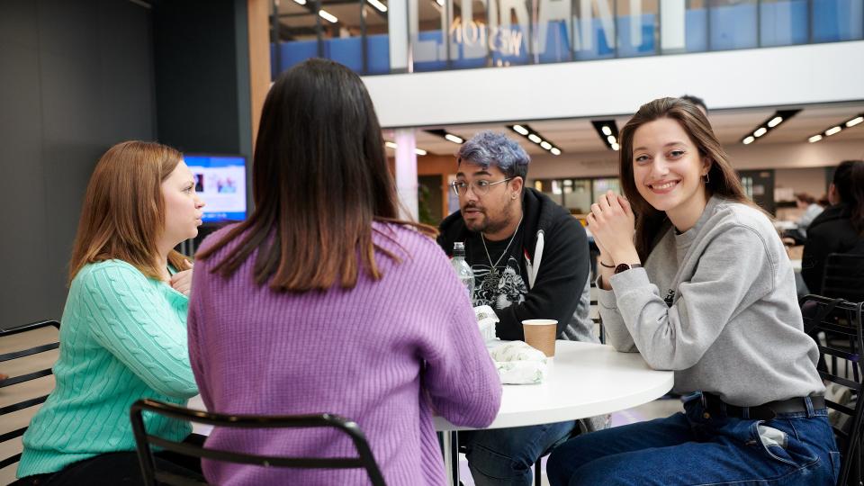 Students sitting around a table