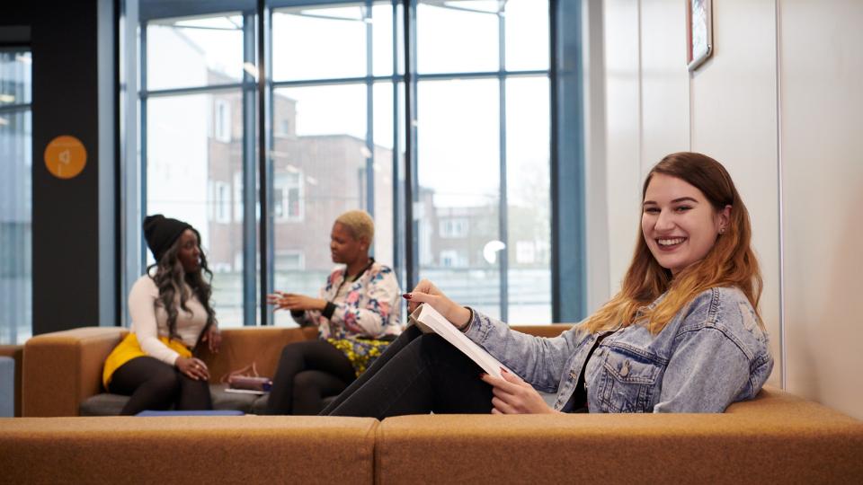 Student reading in library