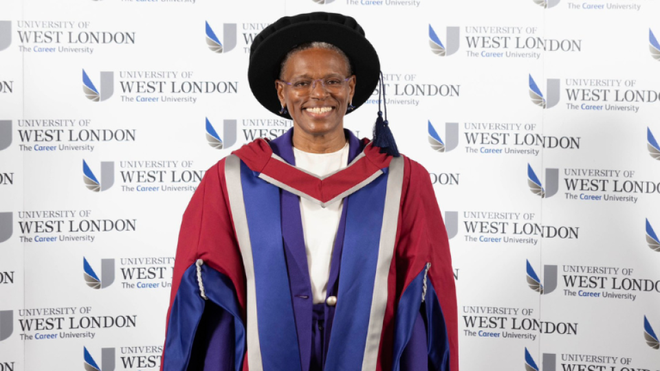 Ijeoma Uchegbu is wearing a gown and hat as an honoree graduate