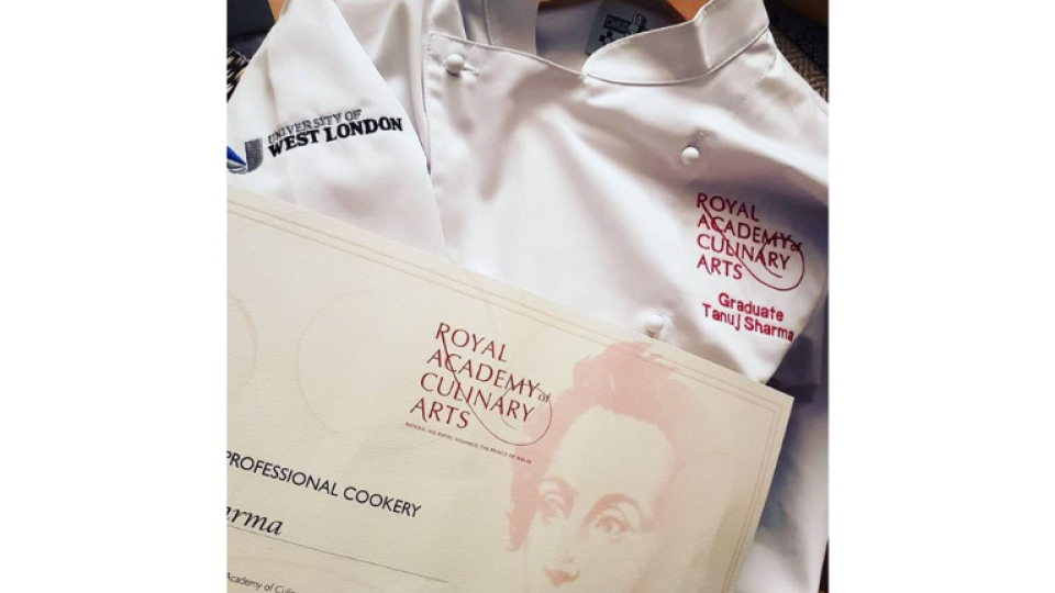 Close us of a University of West London student's chef whites, with a certificate from the Royal Academy of Culinary Arts