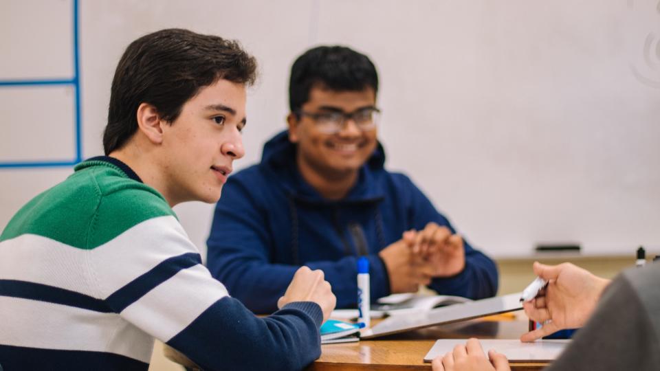 A group of young students studying together.