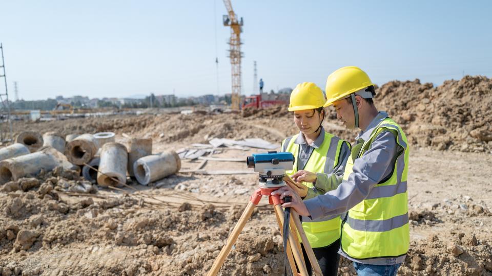 Civil and Environmental Engineering students survey a site