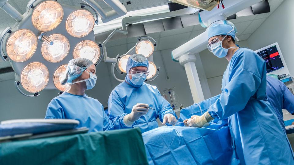 Nurses and students in an operating theatre