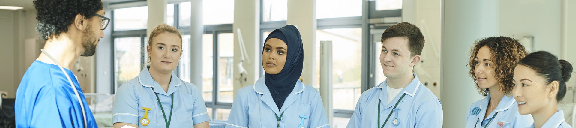 Group of nursing students listen to a senior nurse