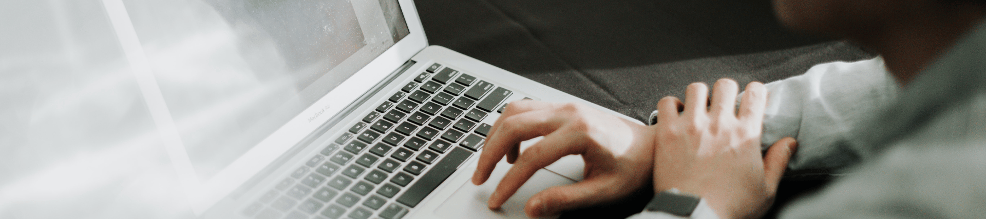 A student working on a laptop.