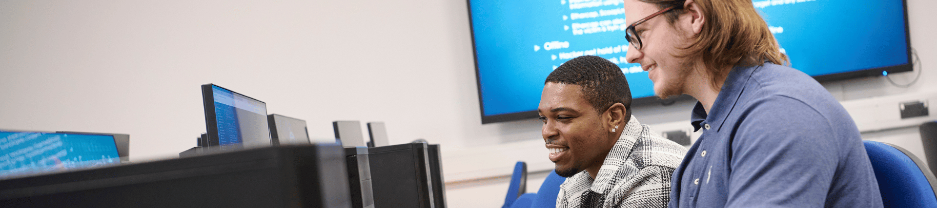 Two students workint together at a computer